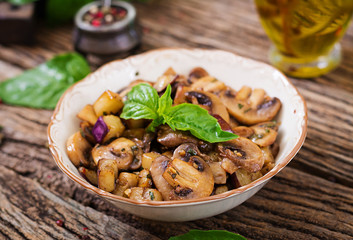 Saute with mushrooms, eggplant, aubergines and basil. Vegetable stew. Vegetarian, vegan food. Healthy meal.