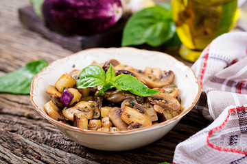 Saute with mushrooms, eggplant, aubergines and basil. Vegetable stew. Vegetarian, vegan food. Healthy meal.