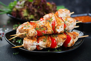 Chicken skewers with slices of sweet peppers and dill. Tasty food. Weekend meal.