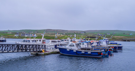 Fototapeta premium Boats at Portmagee harbor in Ireland