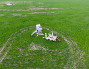 A tank with methanol near the oil well. Equipment of an oil well. Shutoff valves and service...