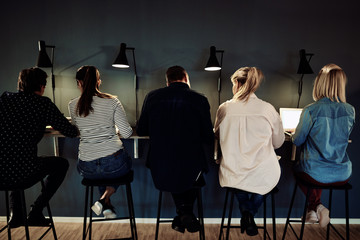 Group of businesspeople working late in an office together
