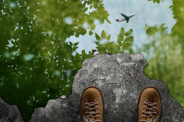 Travel concept, Man Standing to see the Blurred of Tree and Airplane that Reflected on the Wet Cement Floor. Top View