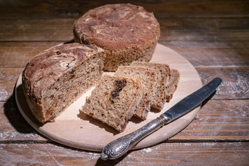 Homemade rye bread on rustic background. Organic food.