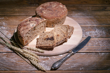 Homemade rye bread on rustic background. Organic food.