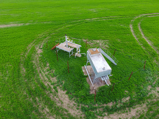 A tank with methanol near the oil well. Equipment of an oil well. Shutoff valves and service...