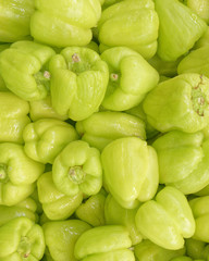 organic green bell peppers top view, food background