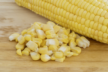 Corn seeds with corn cob on the table