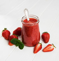 Jar with strawberry smoothie