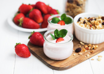 healthy breakfast, yogurt, fresh strawberries and granola