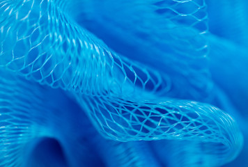Blue synthetic sponge as an abstract background