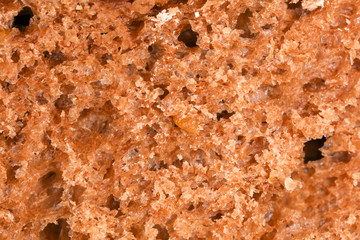 Bread with seeds and raisins as a background