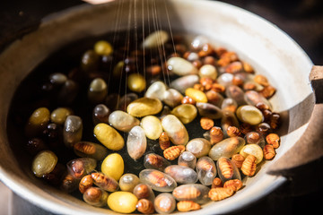 Reeling silk from cocoons using the old traditional process