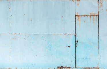 Vintage blue rusty metal sheet door texture background