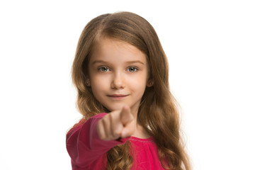 Fototapeta premium The teen girl pointing to you, half length closeup portrait on white background.