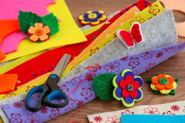 Multi-colored sheets of felt and hand-made articles. Felt for needlework and creativity. Many colorful felt sheets.