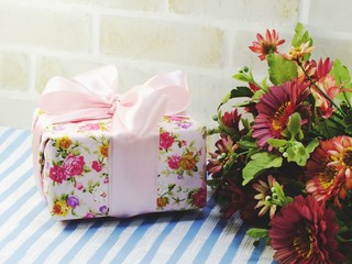 beautiful romantic gift box and artificial flower bouquet