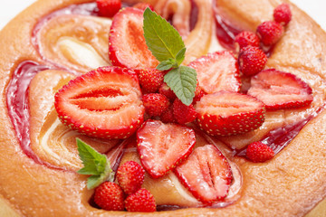 cake with strawberry on wooden background