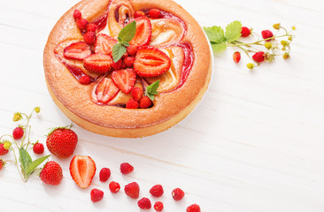 cake with strawberry on wooden background