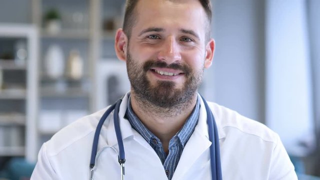 Yes, Serious Confident Doctor Shaking Head to Agree