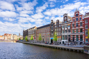 Colorful traditional old buildings in sunshine day at Amsterdam, Netherlands