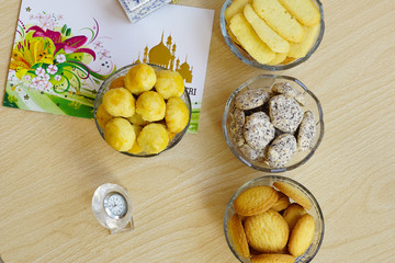 Cookies served during Eid Mubarak celebration with some ornaments and captured top angle shots.