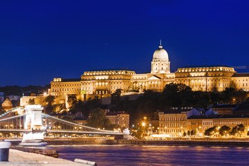 Fototapeta na wymiar View of Budapest National Gallery and Szechenyi Chain Bridge at night from Danube river