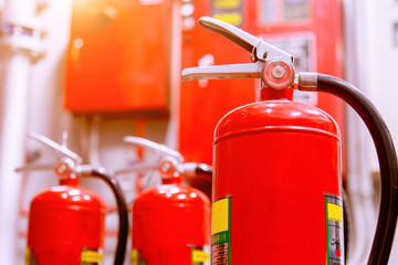 Fototapeta premium Red tank of fire extinguisher Overview of a powerful industrial fire extinguishing system.