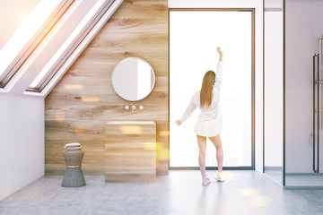 Attic wooden bathroom interior, sink, woman