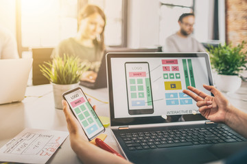 Designers drawing website ux app development.