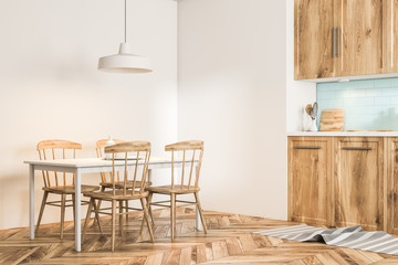 White and wooden Scandi style dining room corner