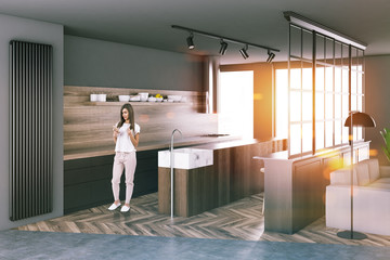 Gray kitchen corner, large windows, woman