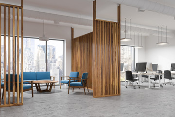 Wood office waiting room corner, blue sofas