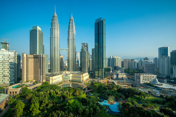 Fototapeta na wymiar Cityscape of Kuala Lumpur Panorama at sunrise. Panoramic image of skyscraper at Kuala Lumpur, Malaysia skyline with blue sky.