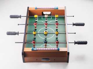 Mini table football foosball soccer with players and ball. isolated