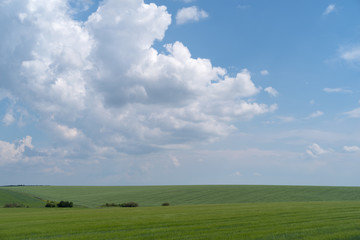 Podolia region, Ukraine. Landscape with dramatic clouds over agricultural field