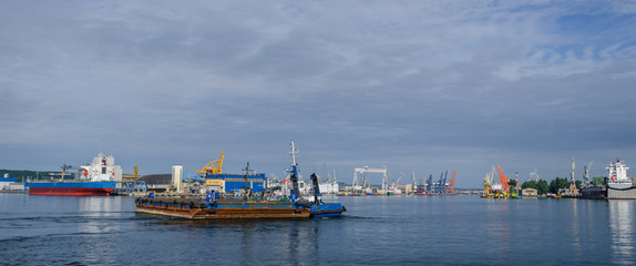 BARGE AND TUGBOAT - Morning traffic at the sea port in Gdynia