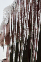 icicles on the roof of the cottage