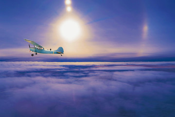 Fototapeta na wymiar Old airplane on the sky 