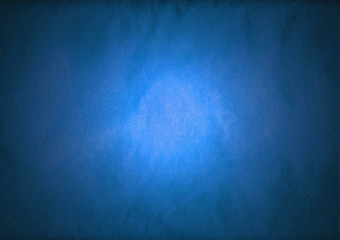 Blue paper with spotlight