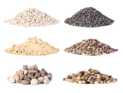 Piles of various gravel, stones and pebbels isolated on white background