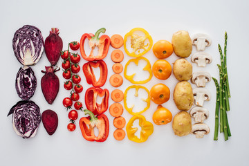 top view of fresh raw healthy vegetables isolated on white