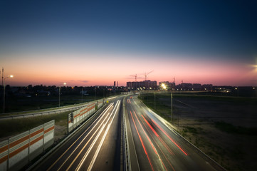 car lights at night on the road going to the city