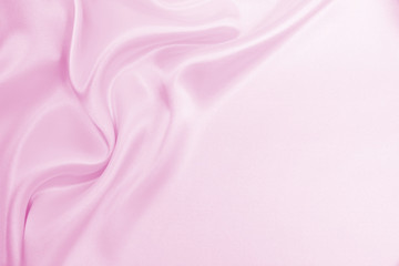 Fototapeta premium Smooth elegant pink silk or satin texture as wedding background. Luxurious valentine day background design