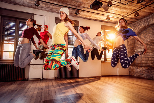 Group of young dancer jumping during music