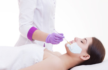 Obraz na płótnie Canvas Spa facial mask application. Spa beauty organic facial mask application at day spa salon.