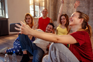 Group of smiling dancers taking selfie- dancing, sport and urban culture concept