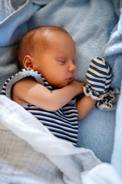 Baby boy sleep calmly in cradle