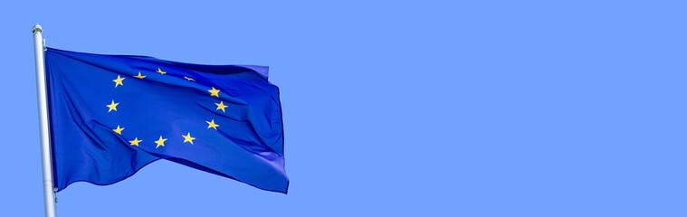 Flag of the European Union waving in the wind on flagpole against the sky on sunny day, banner,...