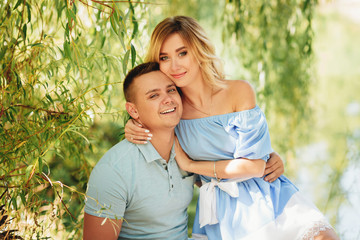 Fototapeta premium Beautiful romantic couple at summer green park